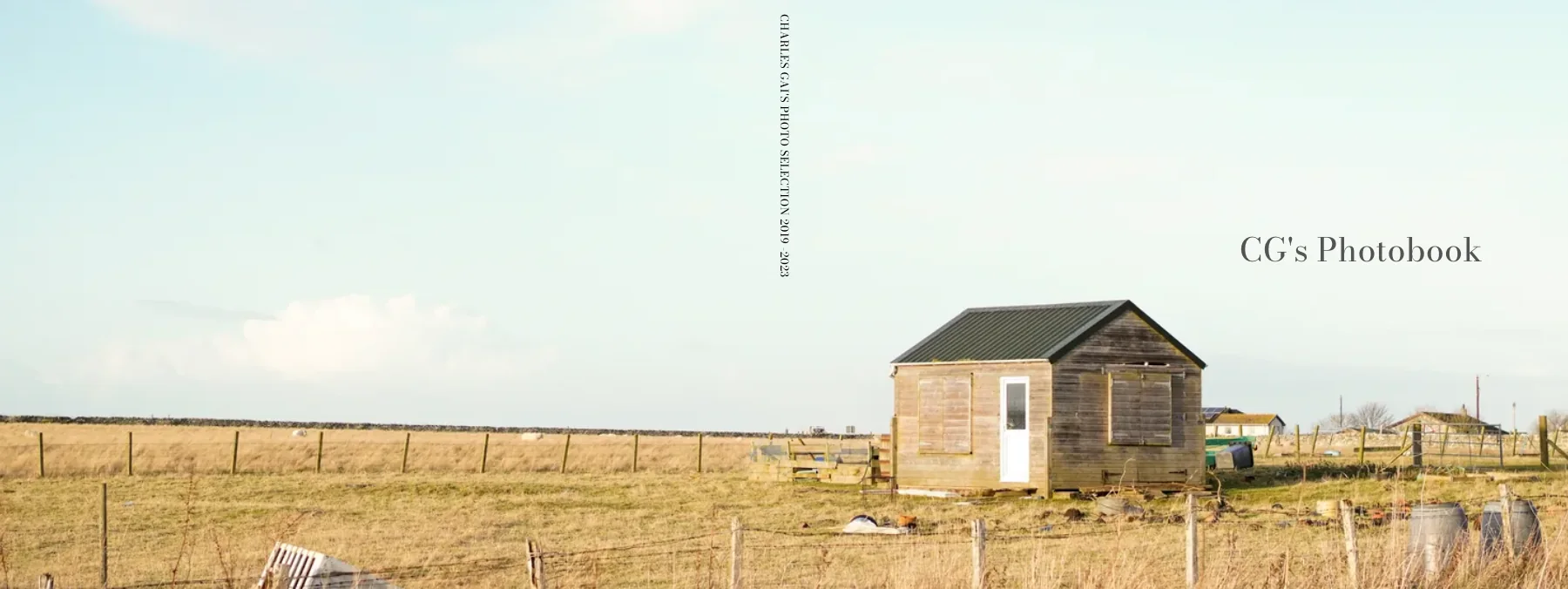 The book's cover: a stone hut in a field of dry grass, titled CG's Photobook